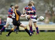 29 January 2005; Marc Hewitt, Clontarf, kicks forward despite the attention of William Wallace, Buccaneers. AIB All Ireland League 2004-2005, Division 1, Clontarf v Buccaneers, Castle Avenue, Dublin. Picture credit; Damien Eagers / SPORTSFILE