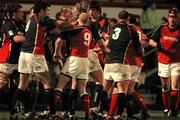 29 January 2005; Peter Stringer, 9, Munster, gets into a tussle with Llanelli Scarlets Mike Phillips, 9. Celtic League, Llanelli Scarlets v Munster, Stradley Park, Wales. Picture credit; TimParfitt / SPORTSFILE