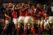 29 January 2005; Players from both  Munster and Llanelli Scarlets get involved in a tussle. Celtic League, Llanelli Scarlets v Munster, Stradley Park, Wales. Picture credit; TimParfitt / SPORTSFILE