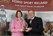 18 November 2013; Gina McCann from Co. Kildare receives the HSI Breeder of the Top International Event Horse award on behalf of her sister Jenny from Jim Beecher, Chairman of the Breeding Sub- Board HSI, during the HSI Annual Breeder Awards. Bloomfield House Hotel, Mullingar, Co. Westmeath.  Picture credit: Barry Cregg / SPORTSFILE