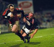 29 January 2005; Christian Cullen, Munster, escapes the clutches of John Davies, Llanelli Scarlets. Celtic League, Llanelli Scarlets v Munster, Stradley Park, Wales. Picture credit; Tim Parfitt / SPORTSFILE