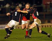 29 January 2005; Christian Cullen, Munster, is tackled by Phil John, left and Simon Easterby, Llanelli Scarlets. Celtic League, Llanelli Scarlets v Munster, Stradley Park, Wales. Picture credit; TimParfitt / SPORTSFILE