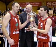 30 January 2005; Abrakebabra Tigers co-captains John Teahan and Kevin O'Donoghue, right, receive the cup from Tony Colgan, President of Basketball Ireland. National Cup, Senior Men's Final, Abrakebabra Tigers, Tralee v Roma St Vincent's, ESB Arena, Tallaght, Dublin. Picture credit; Brendan Moran / SPORTSFILE