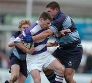 31 January 2005; Richard McElwee, Clongowes Wood, is tackled by Ronan O'Connor, right, and Frank Kearney, St. Michael's College. Leinster Schools Senior Cup, First Round, Clongowes Wood v St. Michael's College, Donnybrook, Dublin. Picture credit; Pat Murphy / SPORTSFILE