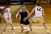 3 February 2005; Mark Solan, Spioraid Naomh, Bishopstown, in action against David O'Keefe (12) and Davy Dalton, Scoil Dara, Kilcock. All-Ireland Schools Cup, U19 B Boys Final, Scoil Dara, Kilcock, Kildare v Spioraid Naomh, Bishopstown, Cork, National Basketball Arena, Tallaght, Dublin. Picture credit; Brian Lawless / SPORTSFILE