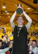 3 February 2005; Denis Crowley, Spioraid Naomh, Bishopstown, lifts the cup after victory in the final. All-Ireland Schools Cup, U19 B Boys Final, Scoil Dara, Kilcock, Kildare v Spioraid Naomh, Bishopstown, Cork, National Basketball Arena, Tallaght, Dublin. Picture credit; Brian Lawless / SPORTSFILE