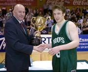 29 January 2005; Galwey Auctioneering Hoops captain Scott Kinevane is presneted with the cup by Tony Colgan, President of Basketball Ireland. National Cup, Junior Men's Final, Mardyke UCC Demons v Galwey Auctioneering Hoops, Dublin, ESB Arena, Tallaght, Dublin. Picture credit; Brendan Moran / SPORTSFILE