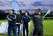 20 November 2013; With Ireland taking on the All Blacks this Sunday, AIG hosted an All Blacks v All Blues skills challenge in Westmanstown, Dublin, today. AIG sponsor both New Zealand Rugby and Dublin GAA and stars from both teams were in attendance as they tried different skills from across all codes as former Dubs sharp shooter Charlie Redmond kept score. In attendance is New Zealand Rugby player Owen Franks watched by former Dublin footballer Charlie Redmond while trying his hand at hurling. Further information about the AIG partnership with Dublin GAA and New Zealand Rugby can be found on www.AIG.ie as well as information on how to win the ultimate All Blacks Experience this weekend. All Blacks v All Blues Skills Challenge, Hosted by AIG, Garda RFC, Westmanstown, Co. Dublin. Picture credit: Brendan Moran / SPORTSFILE