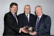 20 November 2013; Ronnie Long is presented with his Lifetime Achievement Award by Minister of State for Tourism and Sport Michael Ring T.D. right, and John Foley, CEO of Athletics Ireland, left, at the 2013 National Athletics Awards in Association with Woodie’s DIY and Tipperary Crystal. Crowne Plaza Hotel, Santry, Co. Dublin. Picture credit: Stephen McCarthy / SPORTSFILE