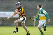 6 February 2005; Derek Lyng, Kilkenny, in action against Michael Cordial, Offaly. Walsh Cup, Semi-Final, Offaly v Kilkenny, St. Brendan's Park, Birr, Co. Offaly. Picture credit; Damien Eagers / SPORTSFILE