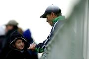 6 February 2005; Brian Kerr, Republic of Ireland manager, signs an autograph for a young supporter during squad training. Malahide FC, Malahide, Co. Dublin. Picture credit; David Maher / SPORTSFILE