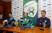 7 February 2005; Republic of Ireland manager Brian Kerr in jovial mood during a press conference after squad training while John O'Shea, left, and Kenny Cunningham, right, look on. Malahide FC, Malahide, Co. Dublin. Picture credit; David Maher / SPORTSFILE,