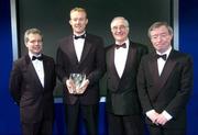 6 February 2005; James Walsh, St. Michael's football club, is presented with the Junior Player of the year award by, from left; Philip Nolan, eircom Chief Executive, and David Blood, Assistant President of the FAI and Minister for Family ans Social Affairs Seamus Brennan T.D., at the 2004 FAI / eircom International Soccer Awards. Citywest Hotel, Dublin. Picture credit; David Maher / SPORTSFILE