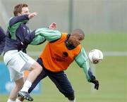 8 February 2005; Republic of Ireland's Clinton Morrisson is tackled by team-mate Stephen McPhail during squad training. Malahide FC, Malahide, Dublin. Picture credit; Pat Murphy / SPORTSFILE