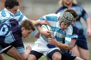 9 February 2005; David Moore, Blackrock College, is tackled by St. Michaels' David Rowan, left and Michael Twomey, Leinster Schools Rugby Cup, Quarter Final, Blackrock College v St. Michaels, Donnybrook, Dublin. Picture credit; Pat Murphy / SPORTSFILE