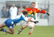 6 February 2005; David Nolan, Carlow, is tackled by James Ward, Monaghan. Allianz National Football League, Division 2A, Monaghan v Carlow, O'Neill Park, Clontibrit, Co. Monaghan. Picture credit; Pat Murphy / SPORTSFILE