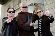 10 February 2005; First there was Live Aid - now 20 years on, it's TRIBUTE AID! At a photocall to announce details of TRIBUTE AID, are from left, Bono cover artist Michael O'Maoileoin, Father Micheal O'Neill, Prior of Terenure College, and from cover band The Polis Sting cover artist David Healion. A group of teachers from Terenure College have got together to instigate a 21st century charity gig in conjunction with GOAL's African appeal which will be held on April 9th in the Olympia theatre. Terenure College, Dublin. Picture credit; Brian Lawless / SPORTSFILE