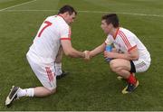 25 August 2013;    ‘You’ll be back’. Alan Freeman, in the Tyrone colours, commiserates with Conor Gormley after Mayo’s success.    Picture credit: Ray McManus / SPORTSFILE    This image may be reproduced free of charge when used in conjunction with a review of the book &quot;A Season of Sundays 2013&quot;. All other usage © SPORTSFILE