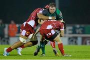 23 November 2013; Michael Swift, Connacht, is tackled by Sione Timani, left, and Adam Warren, Scarlets. Celtic League 2013/14, Round 8, Connacht v Scarlets, The Sportsground, Galway. Picture credit: Diarmuid Greene / SPORTSFILE
