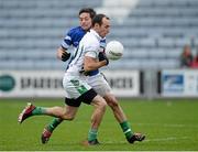 24 November 2013; Kevin Murnaghan, Moorefield, in action against Craig Rogers, Portlaoise. AIB Leinster Senior Club Football Championship Semi-Final, Portlaoise, Laois v Moorefield, Kildare. O'Moore Park, Portlaoise, Co. Laois. Picture credit: Matt Browne / SPORTSFILE