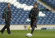 11 February 2005; Out-half Ronan O'Gara, watched by team-mate David Humphreys, in action during kicking practice. Ireland squad kicking practice, Murrayfield, Edinburgh, Scotland. Picture credit; Brendan Moran / SPORTSFILE