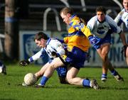 13 February 2005; Michael O'Shea, Clare, in action against   Colm Flanagan, Monaghan. Allianz National Football League, Division 2A, Clare v Monaghan, Cusack Park, Ennis, Co. Clare. Picture credit; Kieran Clancy / SPORTSFILE