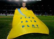 9 February 2005; It was a dream come through for one young Ireland fan recently when he got to lead the Irish and Portuguese teams out on the pitch at Lansdowne Road as part of the Snickers Fair Play team. 5 year old Jack Looney, from Goatstown, in Dublin was one of six children picked to be part of the Snickers team. Jack is pictured here on the pitch just before kick off with the Snickers Fair Play. International Friendly, Republic of Ireland v Portugal, Lansdowne Road, Dublin. Picture credit; David Maher / SPORTSFILE