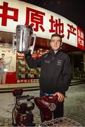 28 November 2013; Clare's Tony Kelly, with the Liam MacCarthy cup, at a local market area near the team hotel on Minsheng Road, Shanghai, in advance of the GAA GPA All Star Tour 2013, sponsored by Opel, game on Saturday. Picture credit: Ray McManus / SPORTSFILE