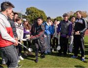 28 November 2013; Galway's David Collins with students of the Shanghai University, including Peng Zhontao who demonstrates his recently acquired skills, during an Introduction to the GAA /  welcome reception for the 2013 GAA GPA All-Stars, sponsored by Opel, hosted by the Shanghai GAA Club. GAA GPA All Star Tour 2013, Sponsored by Opel, Shanghai University, Shangda Road, BaoShan District, Shanghai. Picture credit: Ray McManus / SPORTSFILE