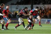 29 November 2013; Felix Jones, Munster is tackled by Francisco Tetaz Chaparro and Cory Hill, Newport Gwent Dragons. Celtic League 2013/14, Round 9, Newport Gwent Dragons v Munster, Rodney Parade, Newport, Wales. Picture credit: Steve Pope / SPORTSFILE