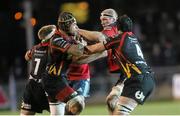 29 November 2013; Paul O'Connell, Munster, is tackled by  Nic Cudd, Netani Talei and Cory Hill, Newport Gwent Dragons. Celtic League 2013/14, Round 9, Newport Gwent Dragons v Munster, Rodney Parade, Newport, Wales. Picture credit: Steve Pope / SPORTSFILE