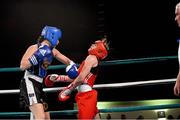 29 November 2013; Ireland's Katie Taylor, Bray Boxing Club, right, takes a powerful punch from Caroline Verveyre, Canada. Road to Rio with Katie Taylor and Bray Boxing Club, Mansion House, Dublin. Photo by Sportsfile