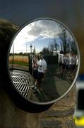 18 February 2005; A reflexed image in a mirror of Ian  Bathard of the PSNI, foreground, and Special Olympic team Ireland athlete Paddy Ellis, at the arrival of the Law Enforcement Torch Run team, sponsored by eircom, at a reception hosted for Team Ireland athletes, coaches and families members. Westmanstown Garda Club Lucan, Co. Dublin. Picture credit; David Maher / SPORTSFILE