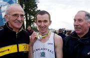 19 February 2005; Gary Murray, centre, St. Malachy's A.C., with Former Irish cross country runner Danny McDaid, left, and Paddy Marley, Competition Secretary, AAI, after his win in the Senior Mens event. AAI National Inter Club Cross Country Championships, Santry, Dublin. Picture credit; Brian Lawless / SPORTSFILE