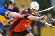 20 February 2005; Gareth Johnson, Down, in action against David Kennedy, Tipperary. Allianz National Hurling League, Division 1B, Tipperary v Down, Semple Stadium, Co.Tipperary. Picture credit; David Maher / SPORTSFILE