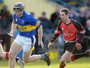 20 February 2005; Mark O'Leary, Tipperary, in action against Andy Savage, Down. Allianz National Hurling League, Division 1B, Tipperary v Down, Semple Stadium, Co.Tipperary. Picture credit; David Maher / SPORTSFILE