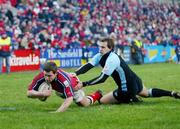 20 February 2005; Jason Holland, Munster, scores a try despite the attentions of Colin Shaw, Glasgow Rugby. Celtic League 2004-2005, Pool 1, Munster v Glasgow Rugby, Thomond Park, Limerick. Picture credit; Kieran Clancy / SPORTSFILE