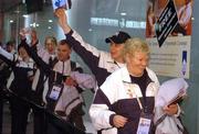 21 February 2005; Special Olympics Team Ireland, sponsored by eircom, athletes, from right to left; Kathleen Sythes, Head Coach, Warren Tate, Stillorgan, Dublin, Cormac Maguire, Ballinteer, Dublin and Lorraine Whelan, Delgany Co. Wicklow, waves to the crowd before departing from Dublin Airport for the 2005 Special Olympics World Winter Games in Nagano, Japan. Dublin Airport, Dublin. Picture credit; Pat Murphy / SPORTSFILE