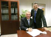 21 February 2005; AIB, one of the partners in Ireland's successful bid to bring the Ryder Cup to Ireland in 2006, has strengthened its Ryder Cup links by signing Christy O'Connor Jnr to be their Ryder Cup ambassador up to and including the event in September 2006. At the signing of a contract in relation to his role as AIB Ambassador for Ryder Cup 2006 is Christy with Billy Andrews of AIB. AIB Bankcentre, Ballsbridge, Dublin. Picture credit; Brendan Moran / SPORTSFILE