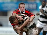 22 February 2005; Eoghan Browne, Belvedere College, is tackled by Andrew Foley, Kilkenny College. Leinster Schools Junior Cup Quarter-Final, Belvedere College v Kilkenny College, Donnybrook, Dublin. Picture credit; Pat Murphy / SPORTSFILE