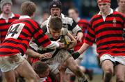 22 February 2005; Eoghan Browne, Belvedere College, is tackled by Andrew Foley and Jonathan Holmes (14), Kilkenny College. Leinster Schools Junior Cup Quarter-Final, Belvedere College v Kilkenny College, Donnybrook, Dublin. Picture credit; Pat Murphy / SPORTSFILE