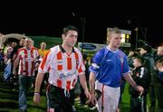 22 February 2005; Derry City captain Peter Hutton, left, and the Linfield captain William Murphy lead out their teams. Pre-Season Friendly, Derry City v Linfield, Brandywell, Derry. Picture credit; David Maher / SPORTSFILE