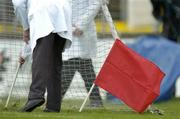 20 February 2005; An umpire places the white flag, used to signal one point, next to the new red flag, which signals a sliotar struck directly over the bar from a sideline cut and is worth 2 points. Allianz National Hurling League, Division 1B, Cork v Limerick, Pairc Ui Chaoimh, Cork. Picture credit; Brendan Moran / SPORTSFILE