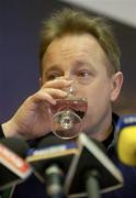 23 February 2005; Ireland coach Eddie O'Sullivan takes a drink during an Ireland Rugby press conference. Citywest Hotel, Dublin. Picture credit; Brendan Moran / SPORTSFILE