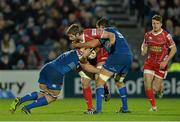 30 November 2013; Aled Thomas, Scarlets, is tackled by Jordi Murpy, left, and Mike McCarthy, Leinster. Celtic League 2013/14 Round 9, Leinster v Scarlets, RDS, Ballsbridge, Dublin. Picture credit: Ramsey Cardy / SPORTSFILE Picture credit: Ramsey Cardy / SPORTSFILE