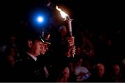 3 December 2013; The Special Olympics Flame of Hope is carried to the stage by Police Service of Northern Ireland Constable Steve Douglas, left, and An Garda Siochana Assistant Commissioner John Twomey during the launch of the of the Special Olympics Ireland Games Limerick 2014. The University Concert Hall, University of Limerick. Picture credit: Diarmuid Greene / SPORTSFILE