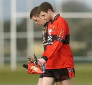 25 February 2005; Donal O'Donovan and goalkeeper David McTierney, UCC, after the final whistle against Sligo IT. Datapac Sigerson Cup Semi-Final, Sligo IT v University College Cork, Dundalk IT, Dundalk, Co. Louth. Picture credit; Matt Browne / SPORTSFILE
