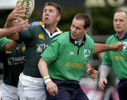 25 February 2005; Japie Mulder, South Africa Legends 15, in action against Andy Matchett, Ireland Legends 15. Legends Game, Ireland Legends 15 v South Africa Legends 15, Templeville Road, Dublin. Picture credit; Brian Lawless / SPORTSFILE