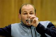 26 February 2005; Coach Andy Robinson takes a drink at an England Rugby press conference prior to their RBS Six Nations game against Ireland. Four Season's Hotel, Dublin. Picture credit; Brendan Moran / SPORTSFILE