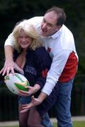 26 February 2005; England fans Lynn Marshall with husband Gareth Marshall, from Deal, Kent, get to grips with a rugby ball prior to the RBS Six Nations game against Ireland. St. Stephen's Green, Dublin. Picture credit; Brian Lawless / SPORTSFILE